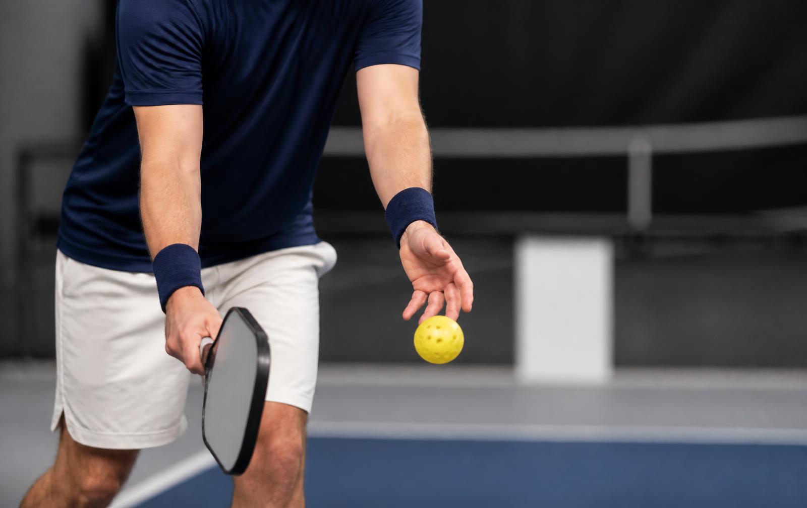Close view of an underhand pickleball serve